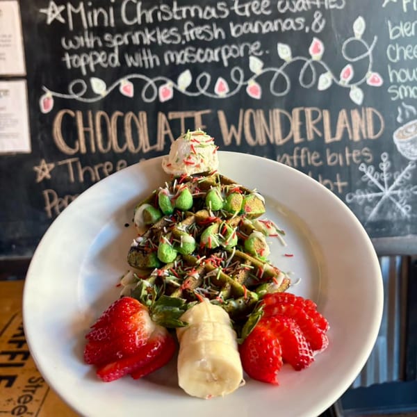 Water Street Waffle Co.'s Christmas tree waffles with sprinkles, mascarpone, strawberries, and banana.